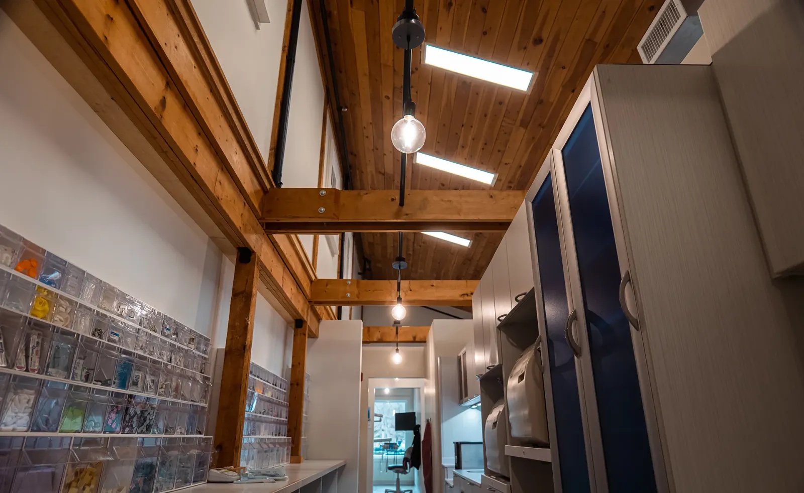 Licensed electricians installing interior ceiling lighting for commercial property
