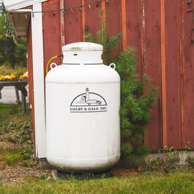 Colby & Gale propane tank outside building.