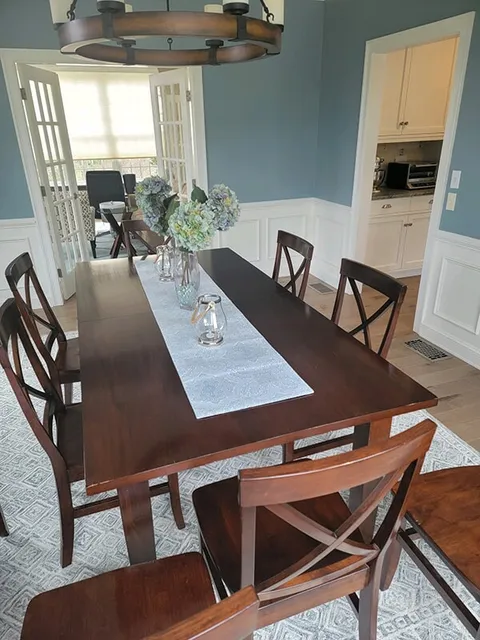 Hardwood floors under an area rug in Ashland, MA