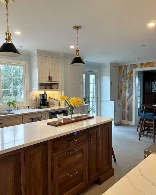Kitchen remodel with walnut island by Adael Construction