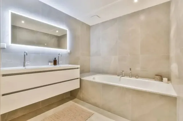 Modern bathroom remodel with freestanding tub, glass shower and large-format tile in Stamford, CT