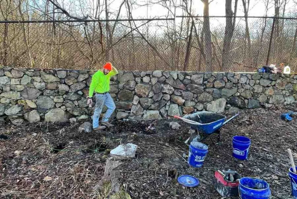 mason from Bradfield Masonry working on job in Boston