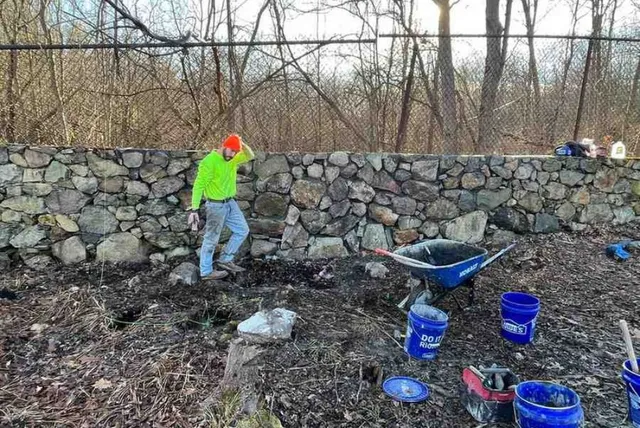 mason from Bradfield Masonry working on job in Boston