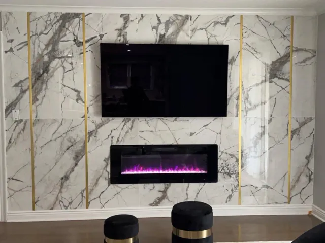 Marble fireplace wall with brass inlay strips, a linear fireplace and a bar counter