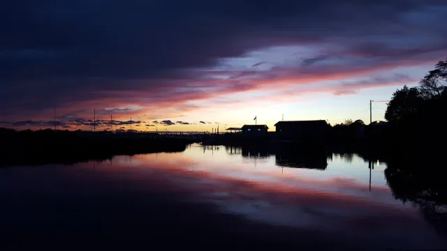 Sunset at dusk over the water in Clinton, Connecticut.