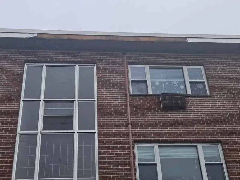 A brick building with a lot of windows on it.