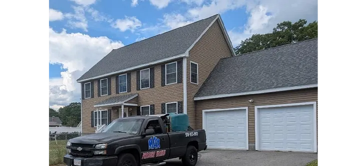 Max Pressure Washing truck in front of clean house