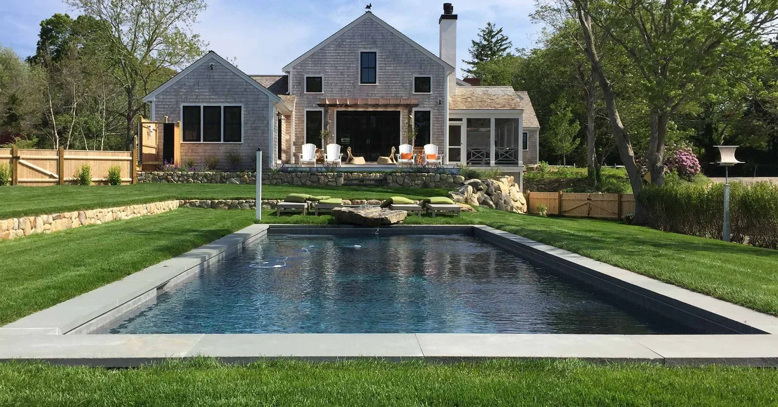 Pool set into ground with grass around it