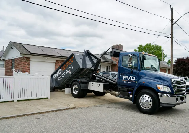 Roll-off dumpster placed in a tight residential driveway