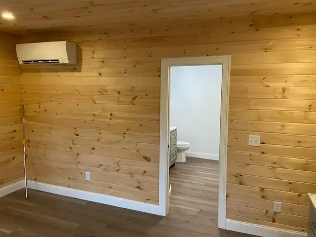 Light wood walls with white trim