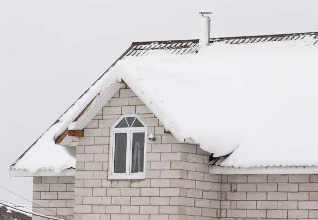 Residential roof with snow on it