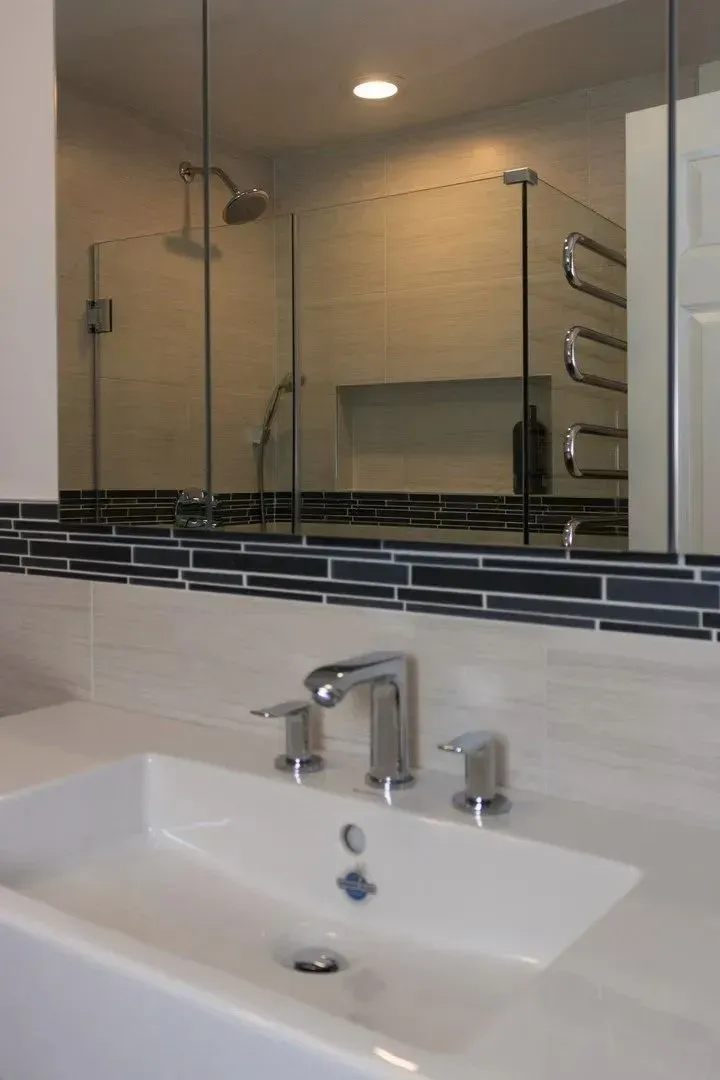 Bathroom vanity and tiled shower