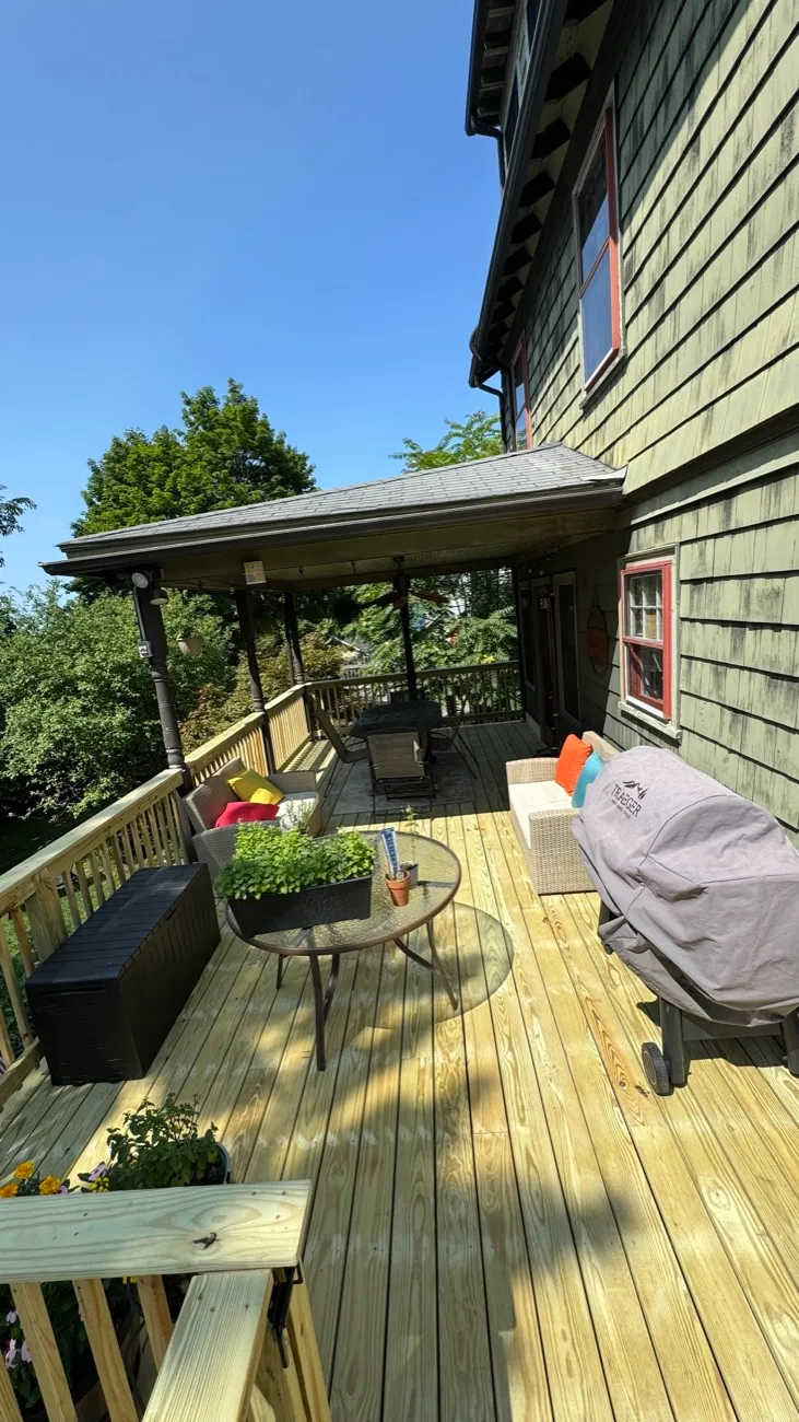 Covered deck furnished with outdoor seating
