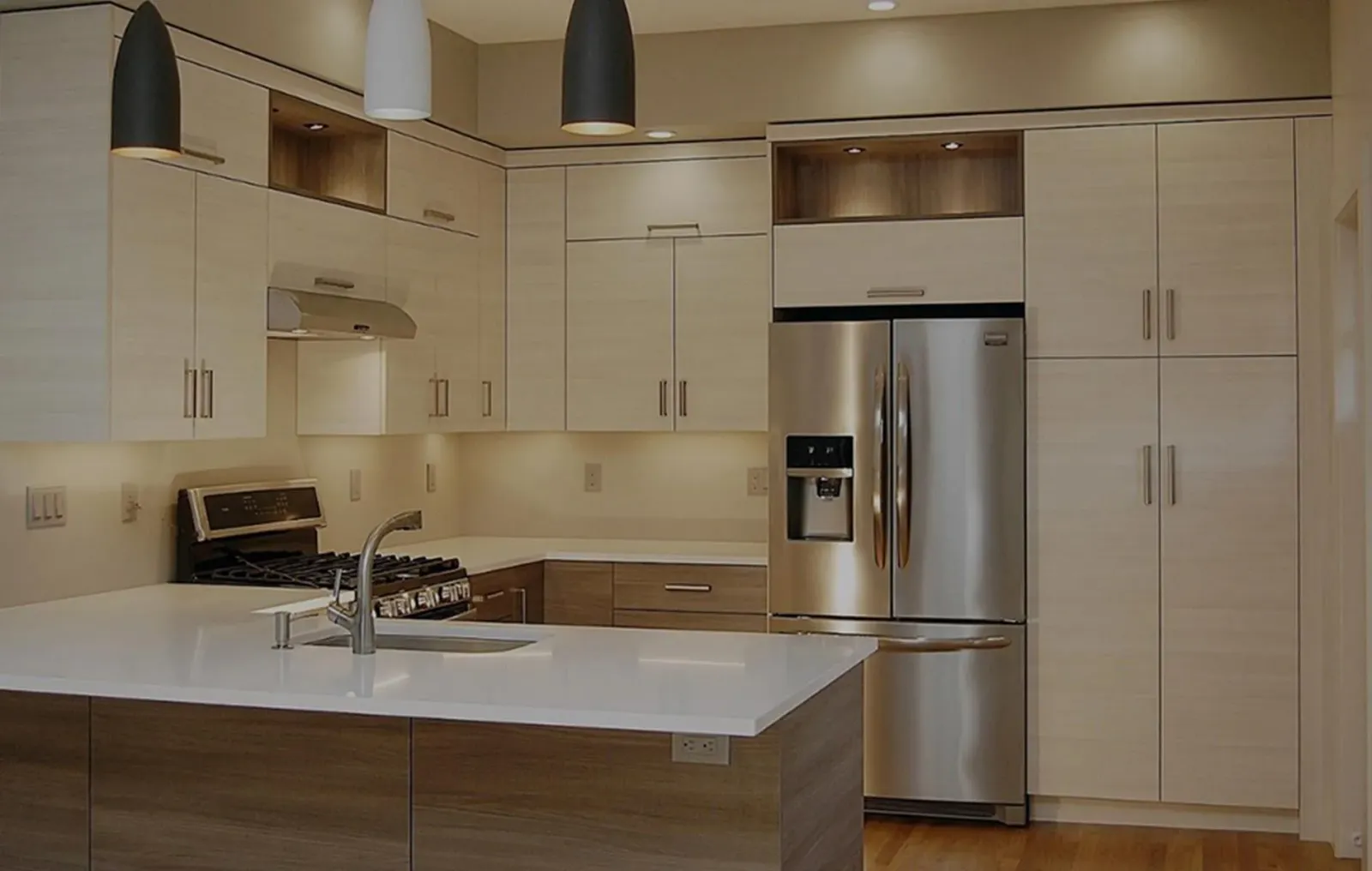A kitchen with stainless steel appliances and white cabinets