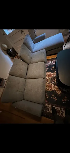Gray sectional couch with a chaise inside a home