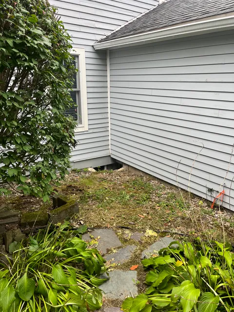 Before — Elite Landscapes property cleanup, Stratham NH