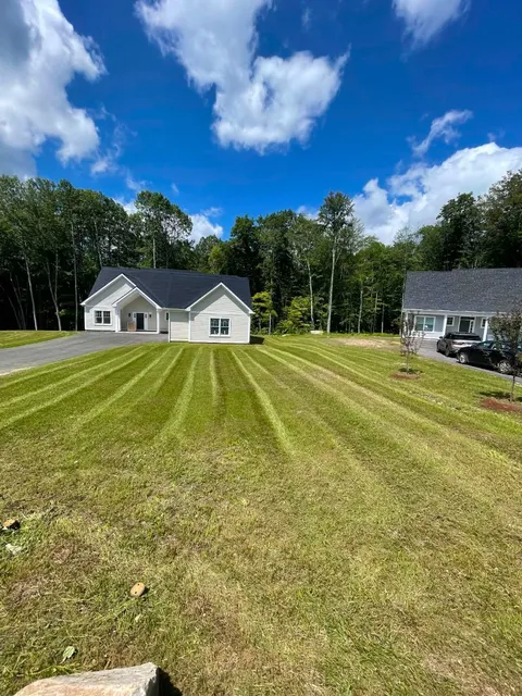 Freshly mowed lawn with crisp stripes at a newly built home