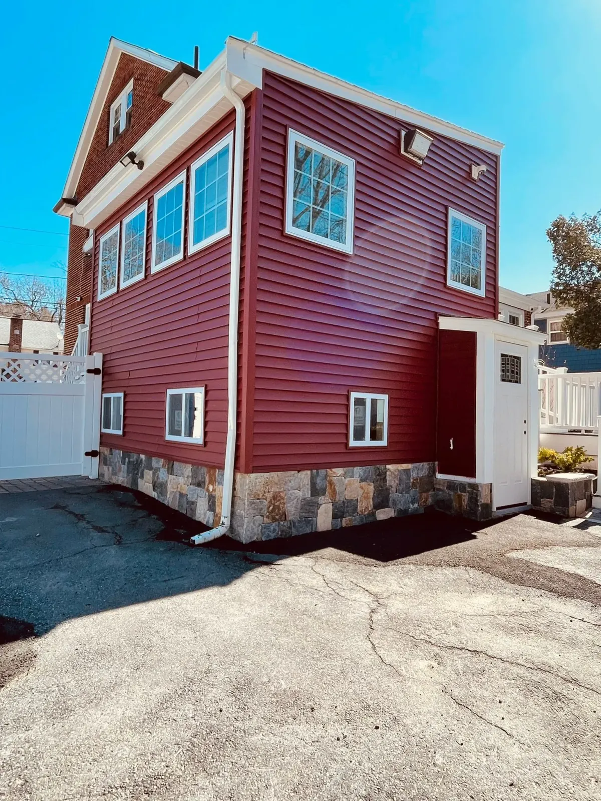 A large red house with a lot of windows
