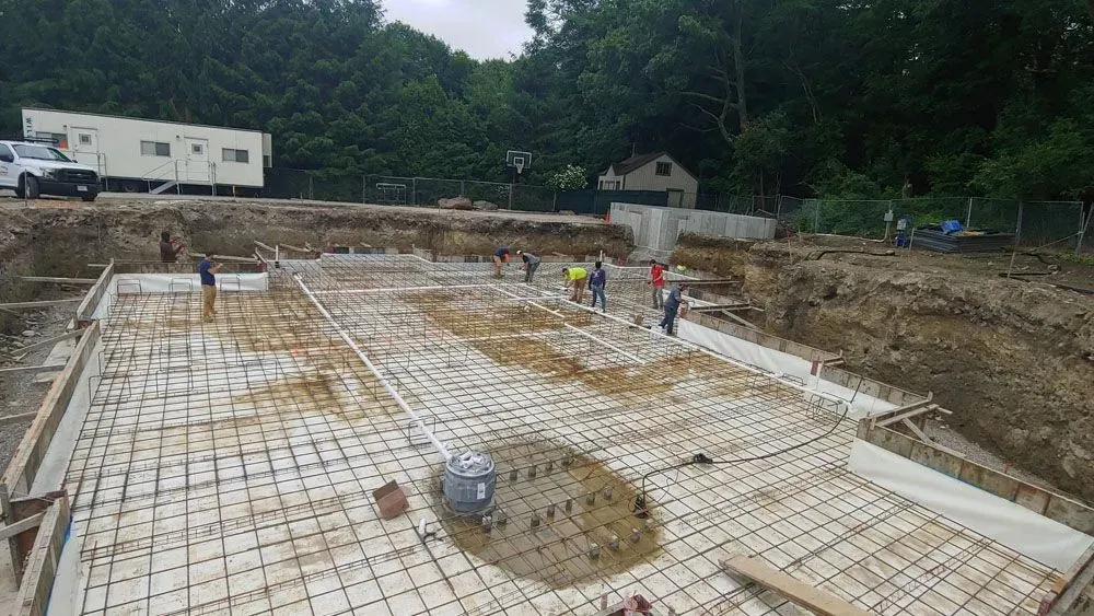 A group of people are working on a construction site.