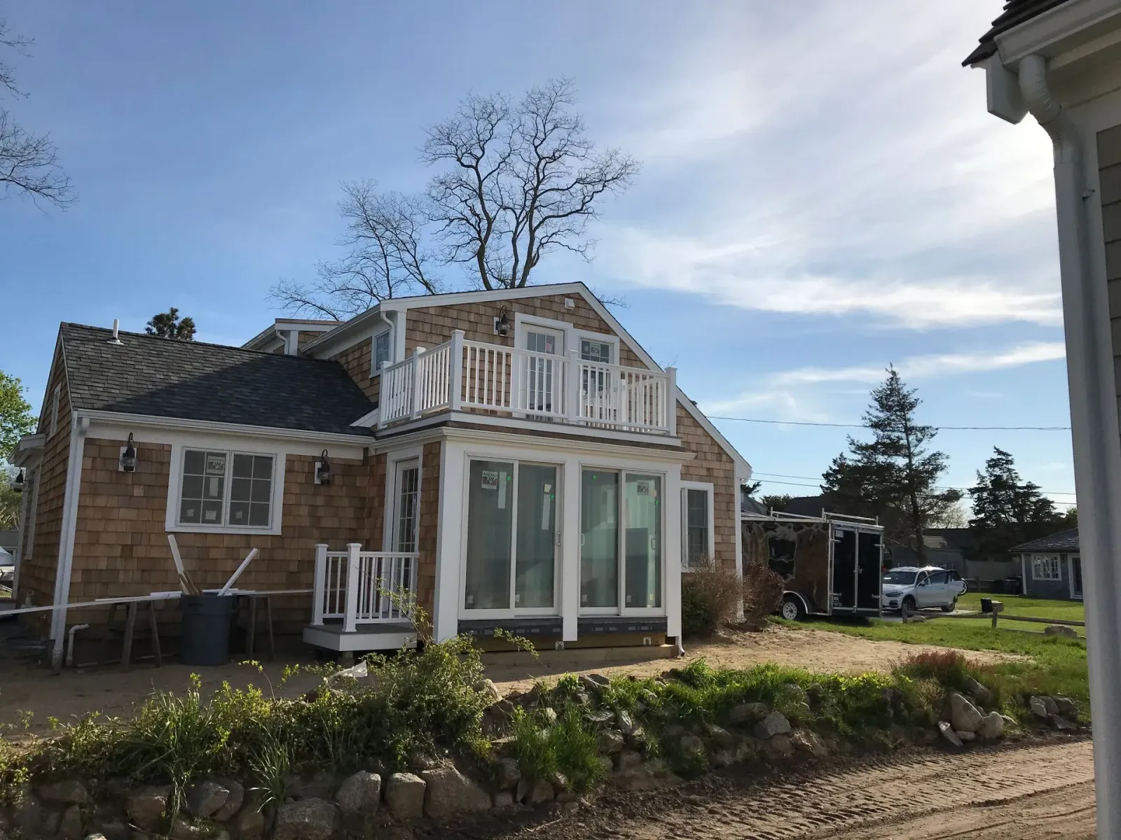 A small house with a balcony on top of it