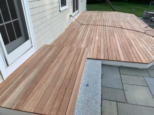Mahogany deck stripped, sanded and stained — before