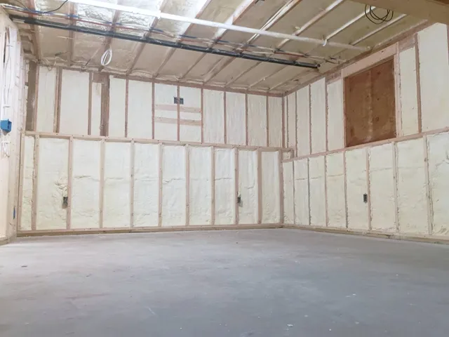 Interior room with spray foam insulation in walls and ceiling areas in New Hampshire