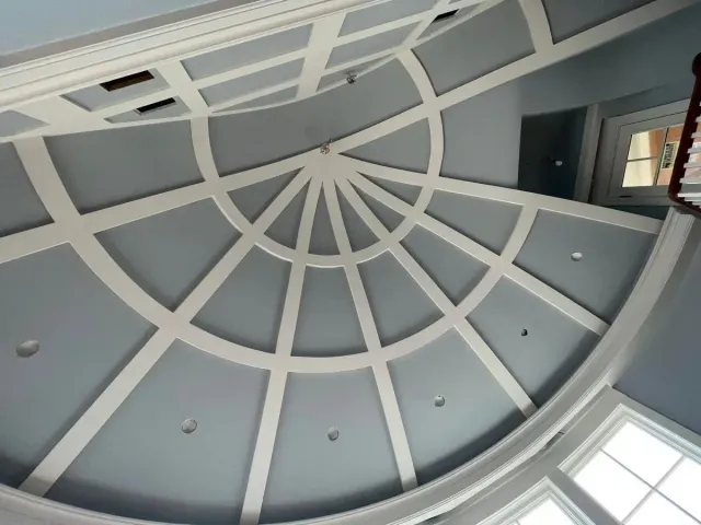 A ceiling with a circular design on it
