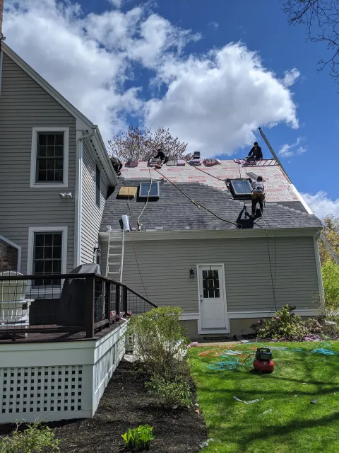 Roofing Company Workers Replacing Residential Roof