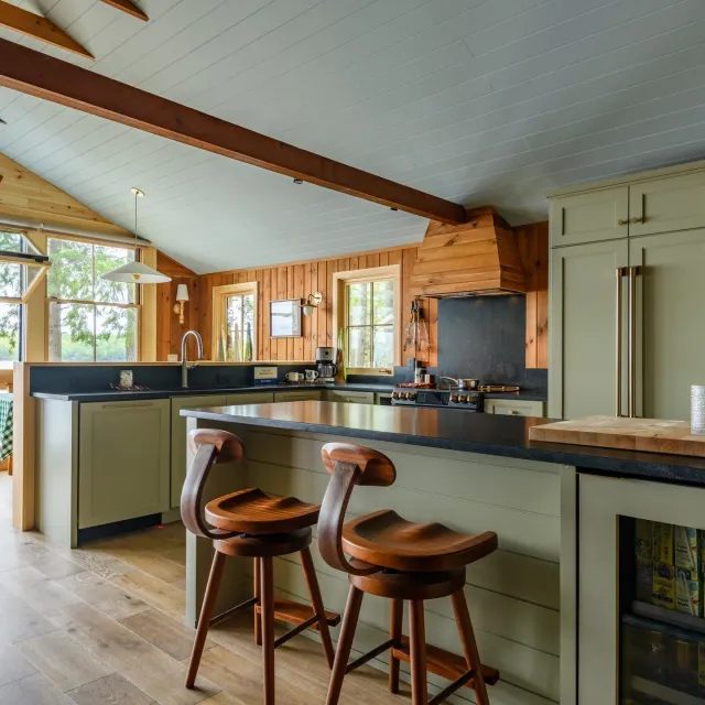 Dreaming of lake life? 🌿✨ Our latest install at a Naples, Maine lake house blends modern function with timeless charm. Every detail&mdash;from the sleek custom cabinets and soft-close drawers to hidden utensil &amp; cutting-board pullouts&mdash;was