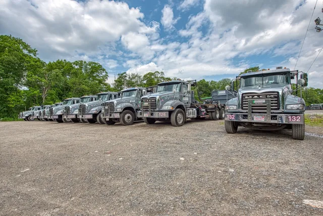 "Northeast Recycling dumpster trucks ready for service in Avon, MA.