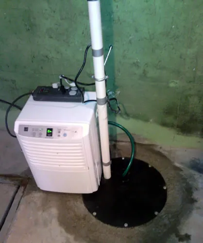 Sump pit with new cover, discharge line and dehumidifier