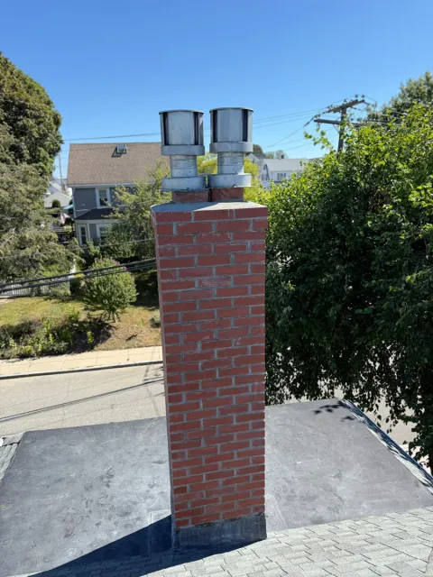 Tall chimney dual caps tuckpointed — Chimney Goat project