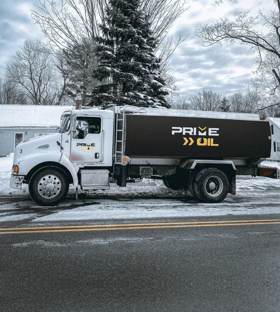 Prime Oil heating oil delivery truck parked on a snowy Springfield street
