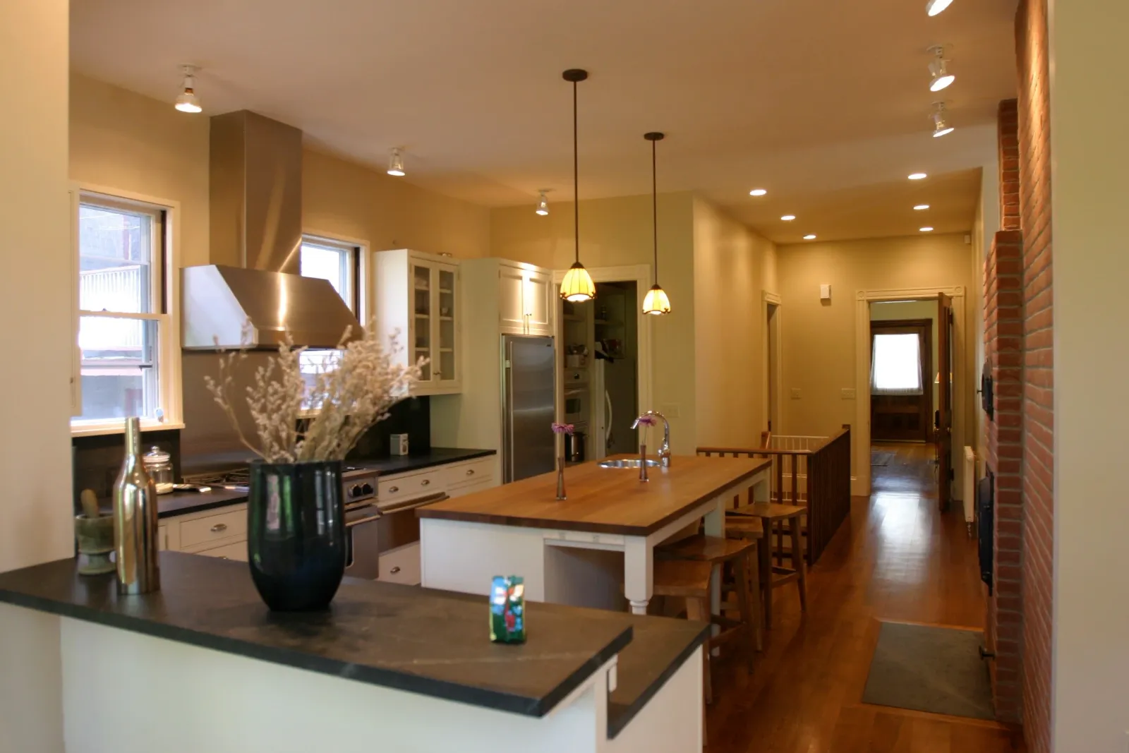 Kitchen and dining renovation with exposed brick chimney