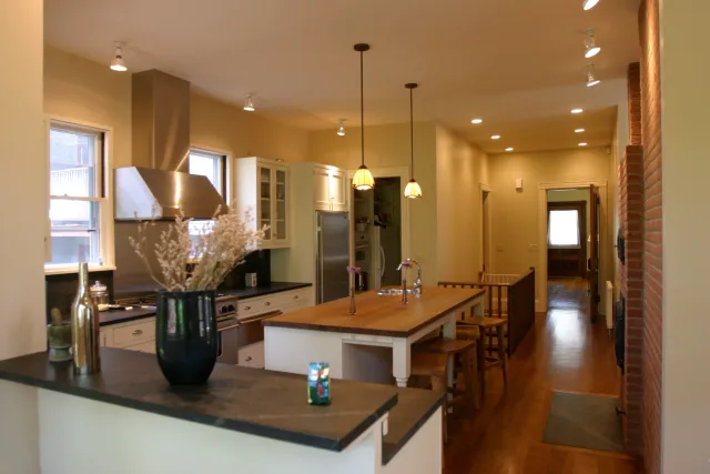 Kitchen and dining renovation with exposed brick chimney