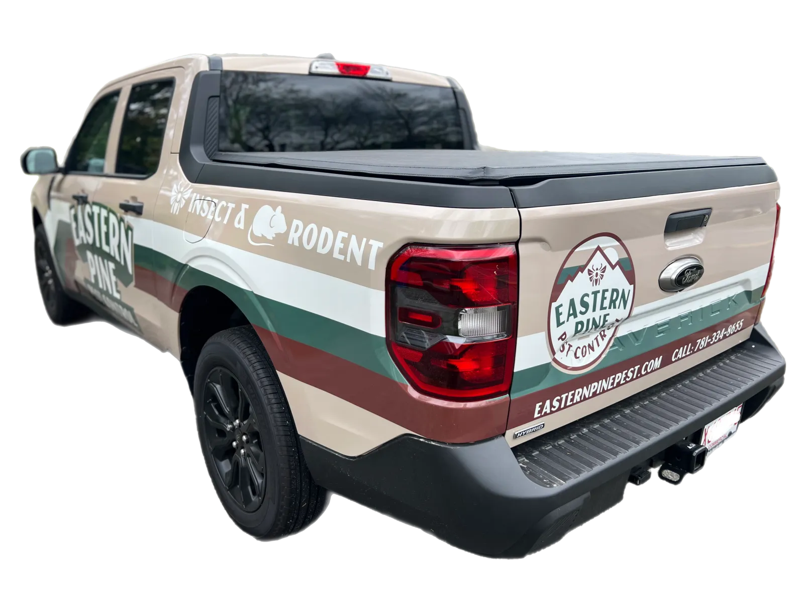 A beige and green pickup truck with "Eastern Pine Pest & Wildlife" branding and contact information displayed on the side and tailgate.