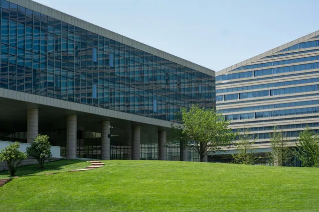 Modern office building with green lawn
