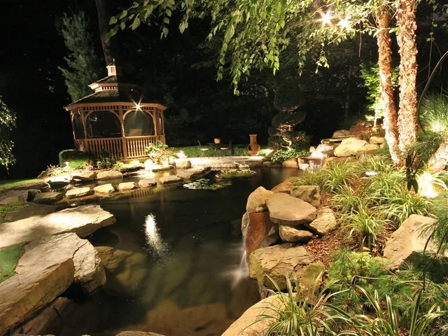 Illuminated patio and fireplace at night