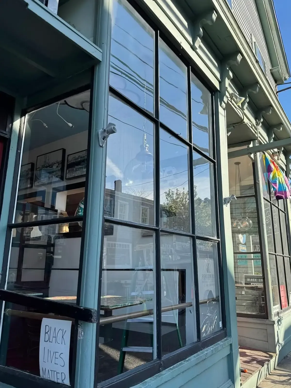 Aftermath photo of the cleaned windows of a Provincetown business
