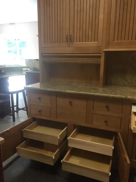 Kitchen cabinet remodeling with lots of drawers and storage.