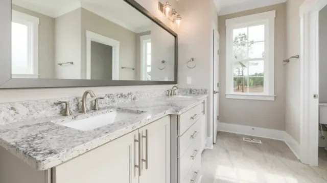 Granite double-sink bathroom vanity countertop installed by Precision Granite Works in a New Hampshire home
