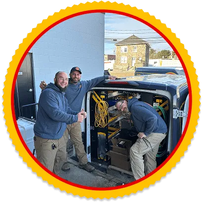 Yellow Dog technicians standing by an open service van