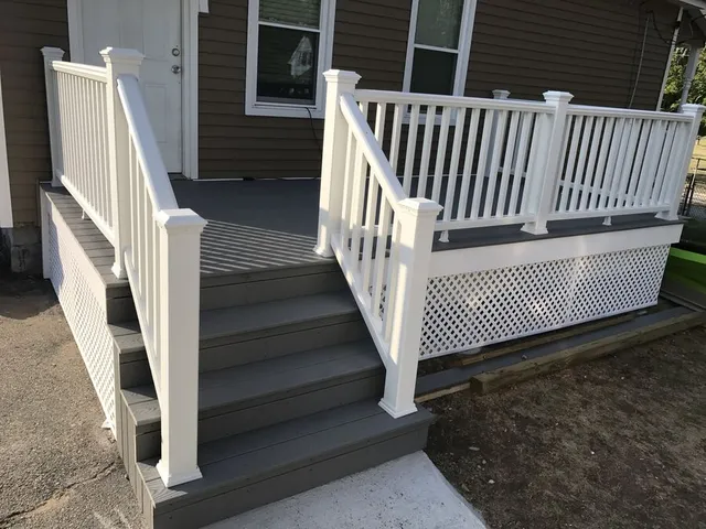 Completed composite deck with white railings and lattice skirt