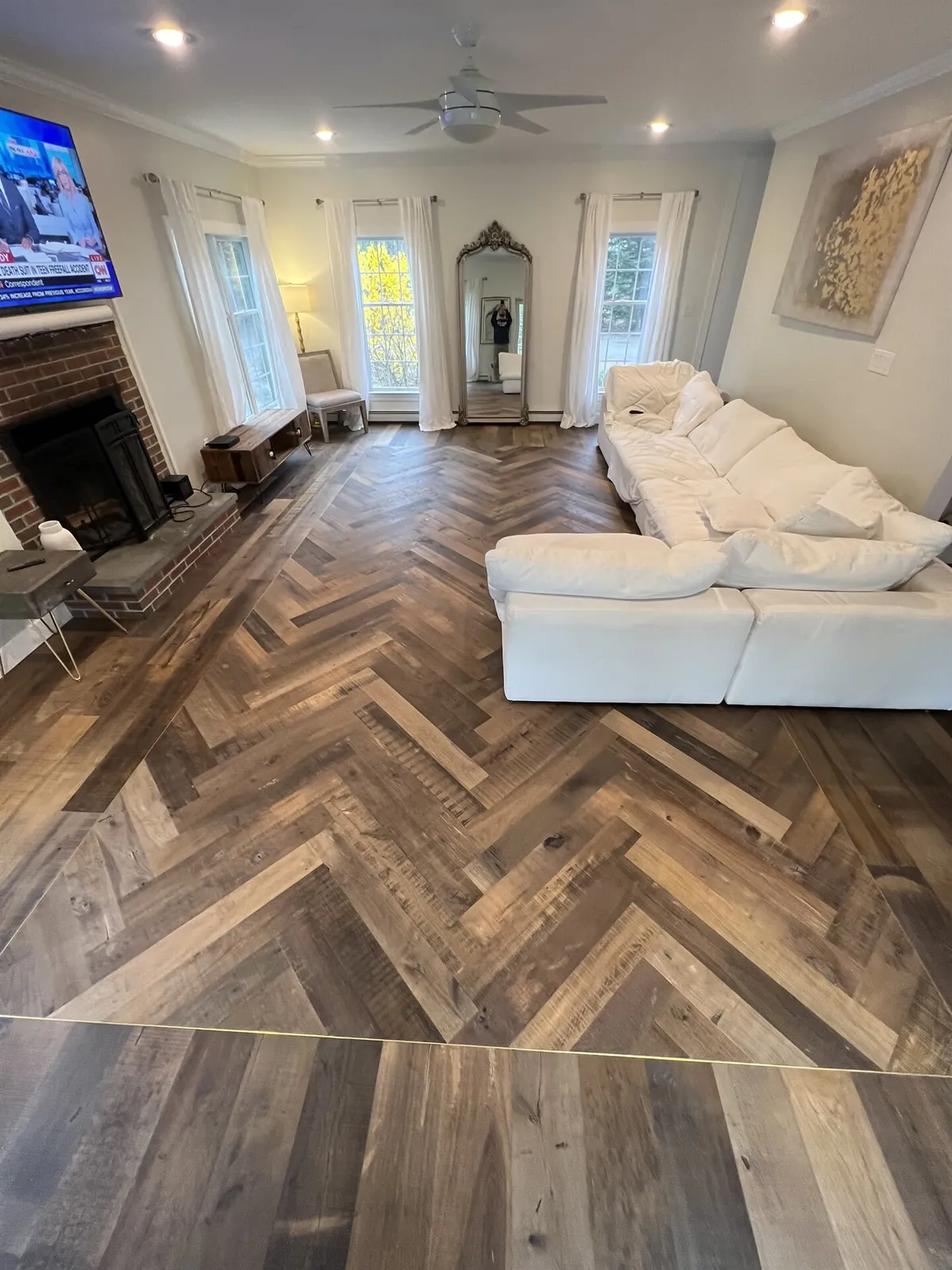 Living room with light and dark hardwood floors in Ashland, MA from Marra Flooring & Design
