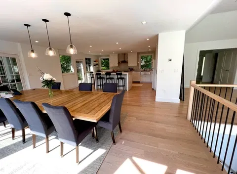 open concept dining area with modern lighting in Connecticut home remodeling
