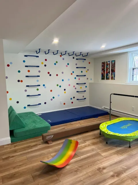 Basement remodel in Hanover, NH for repeat clients. Empty space turned into an office, gym, and play area for the kids.