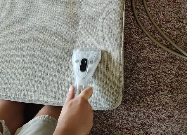 upholstery steam cleaning on a couch cushion