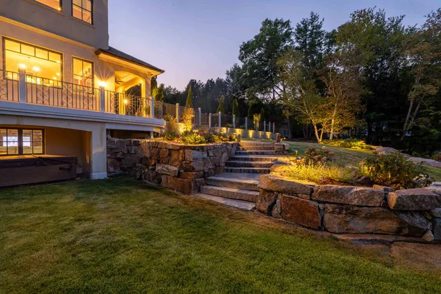 Gloucester, MA landscaping: stone retaining walls and steps at dusk