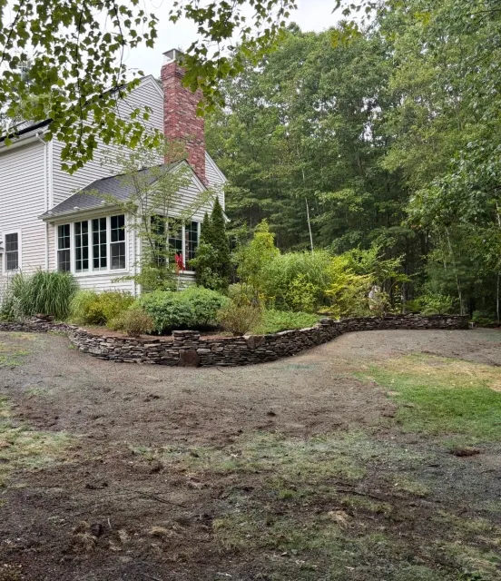 Natural flat stack wall with elevated bed - Pembroke NH