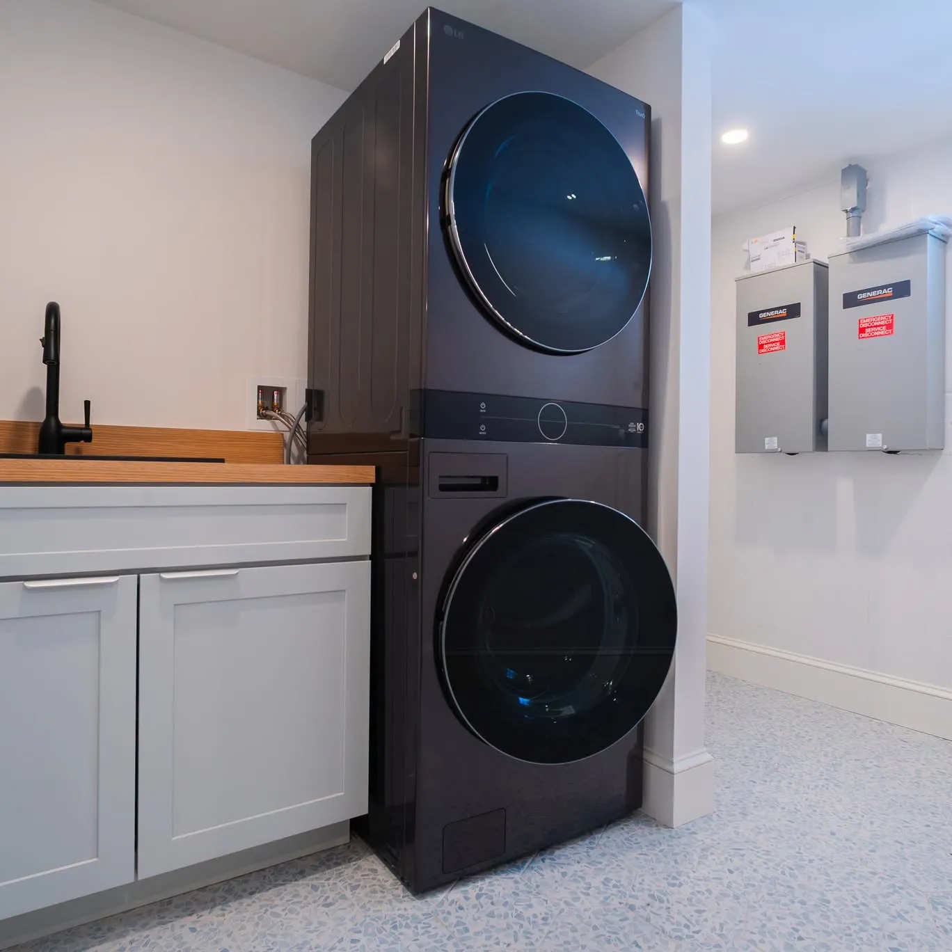 Laundry room with utility sink, wood counter and new service panels